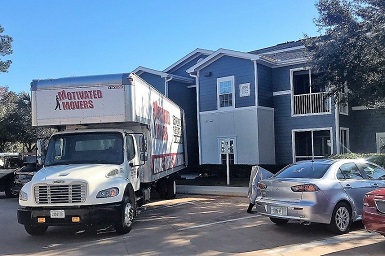 Motivated Movers Auburn Truck parked in front of a customer's home, ready to serve all the time.